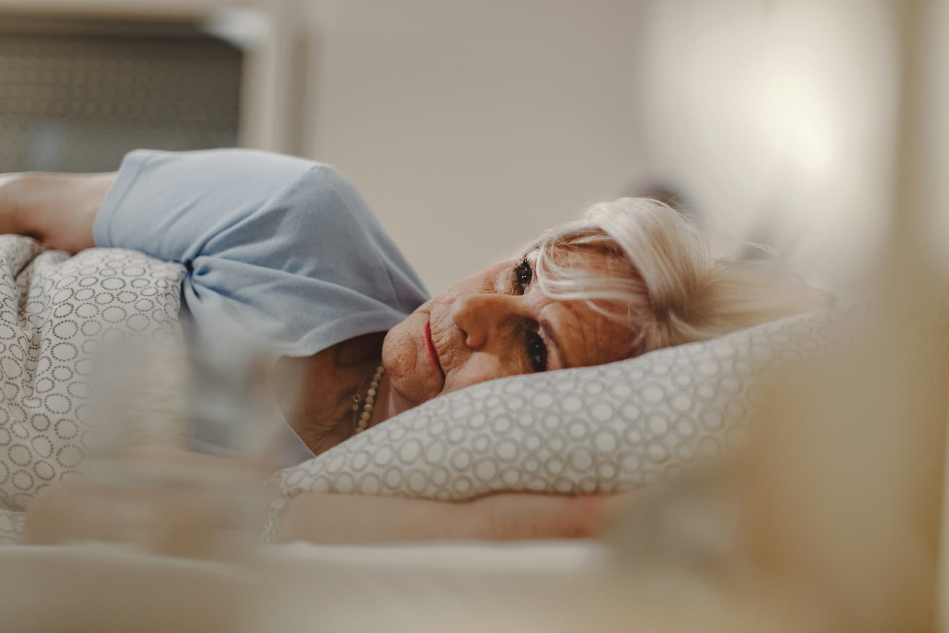 a woman lying on a pillow
