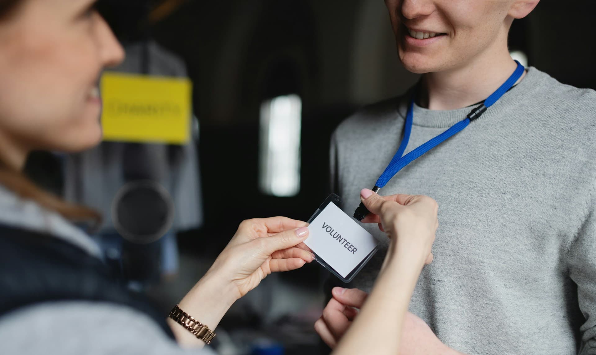 a person handing a badge to a person